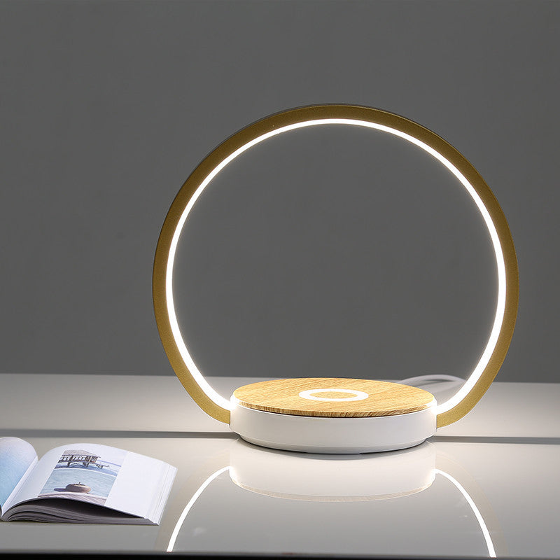 Mobile phone wireless charging with induction lamp