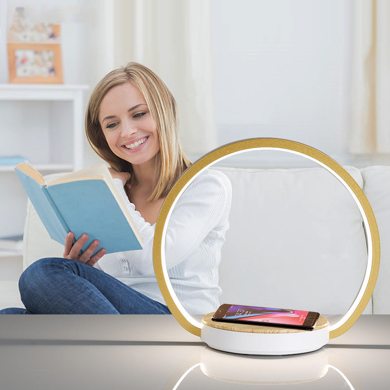 Mobile phone wireless charging with induction lamp